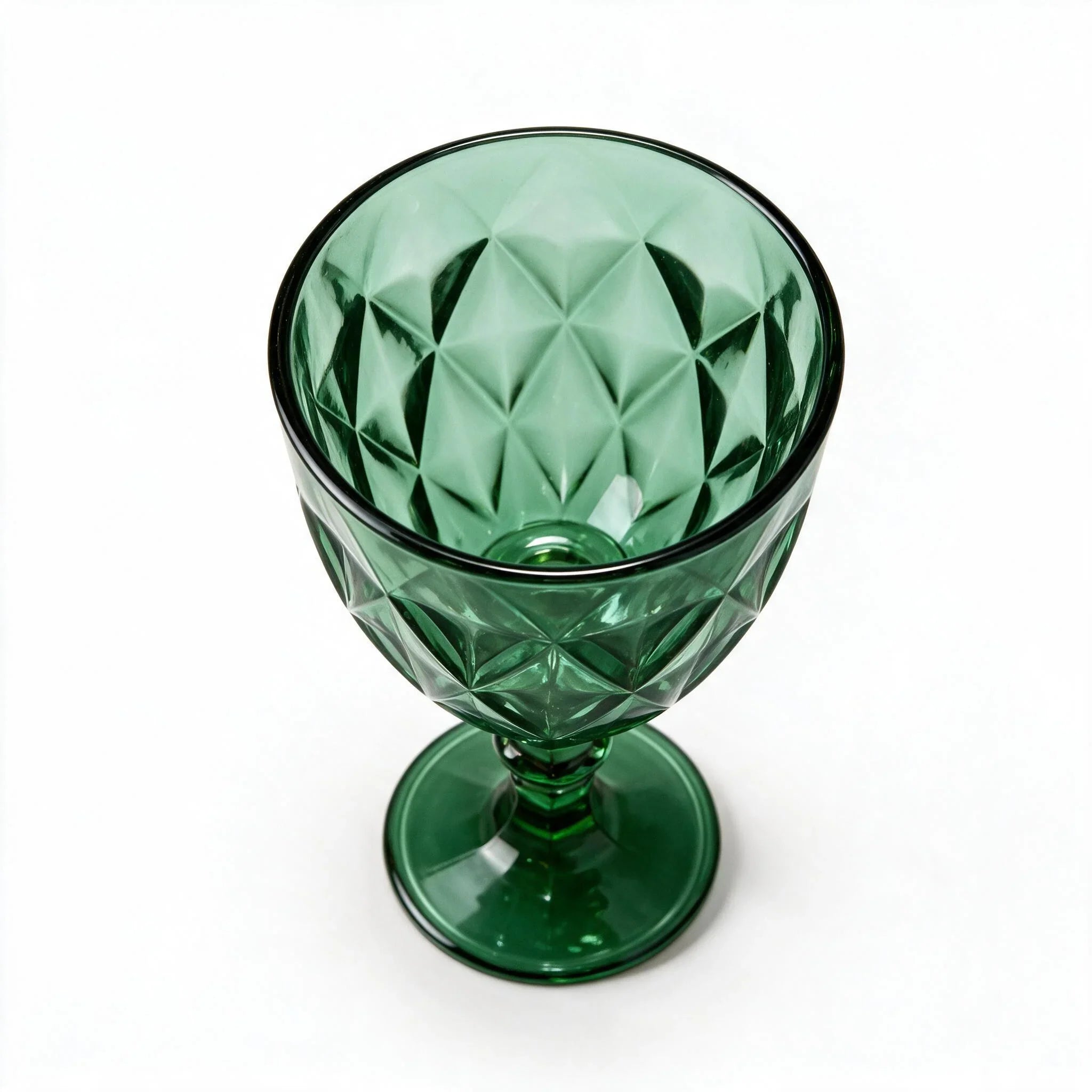 Sylvan green cocktail glass with diamond cut facets and a short stem