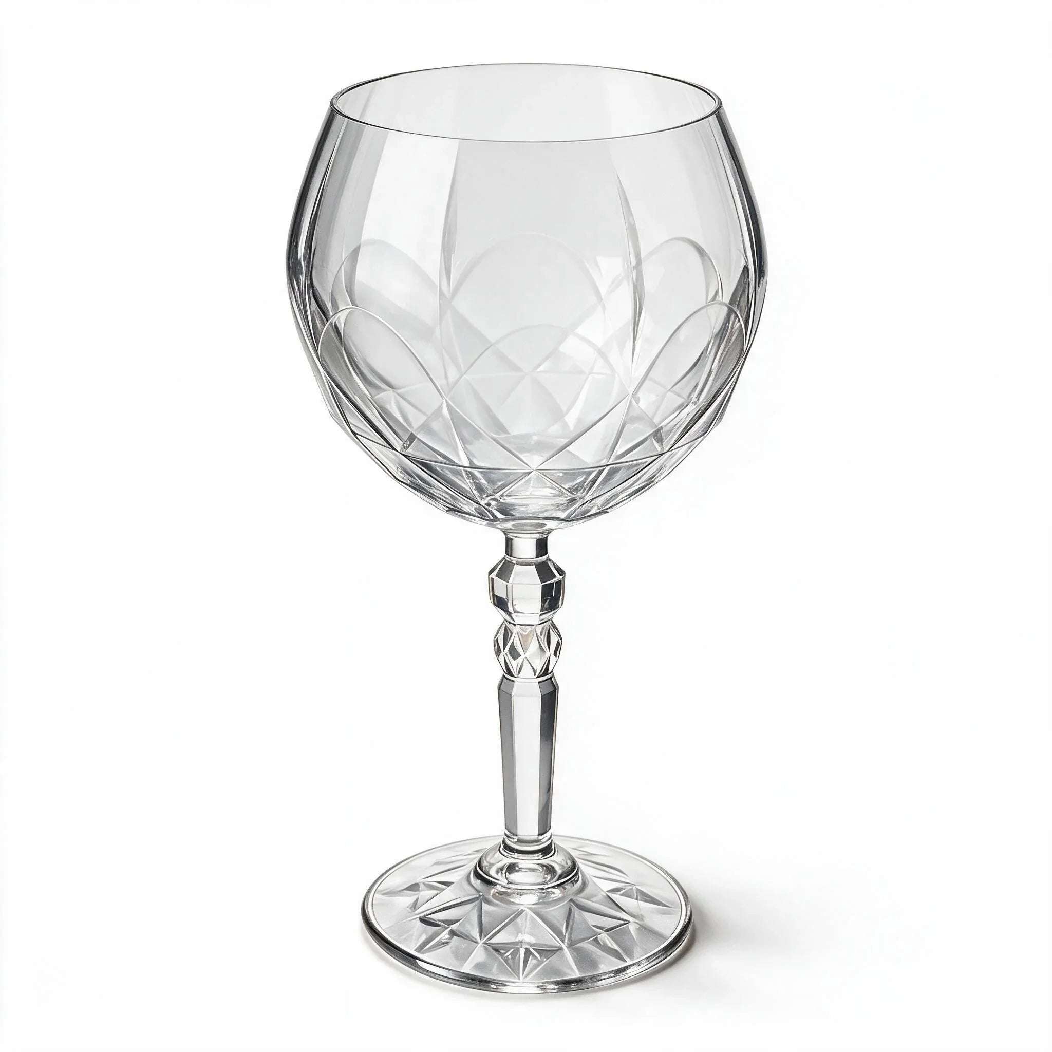 Lumina clear cocktail glass with a tall stem and geometric diamond cut bowl