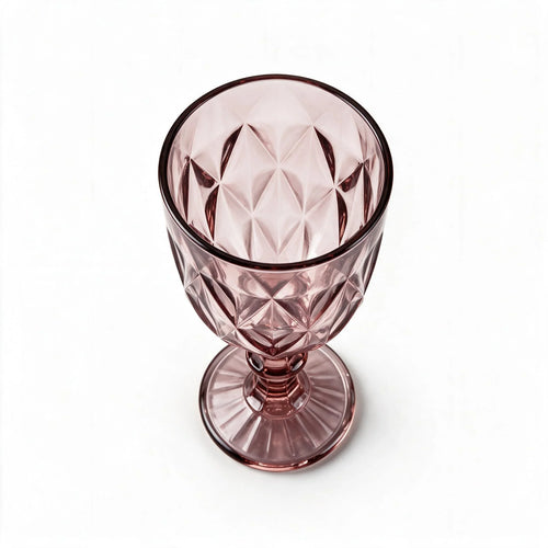 Amara dusky rose cocktail glass with diamond cut facets and a short stem
