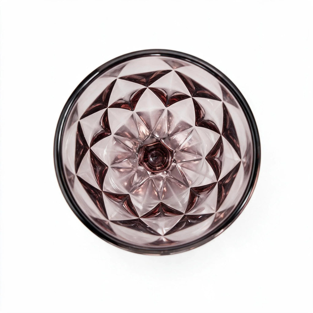 Amara dusky rose cocktail glass with diamond cut facets and a short stem