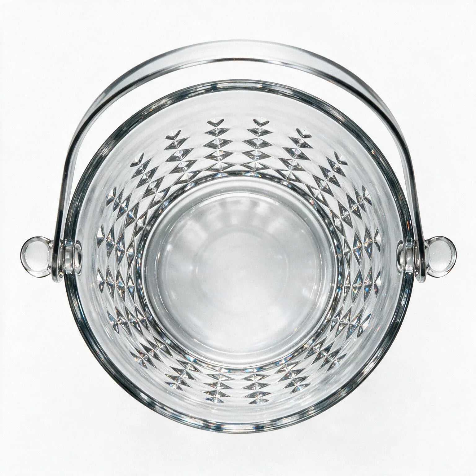 Valen clear glass ice bucket with diamond cut facets and a metal handle