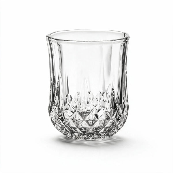 Lyra classic whiskey glass featuring a geometric diamond pattern and softly faceted sides