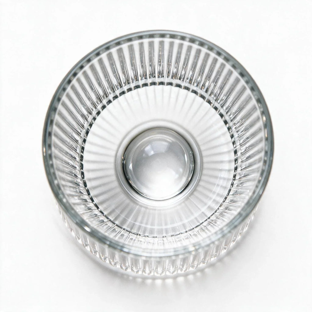 Coda clear whisky glass with a rotating base and ribbed texture
