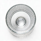 Coda clear whisky glass with a rotating base and ribbed texture