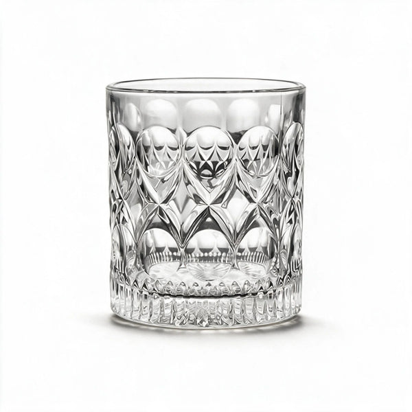 Cadence classic whiskey glass featuring a heavily textured geometric pattern and flat base