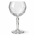 Lumina clear cocktail glass with a tall stem and geometric diamond cut bowl