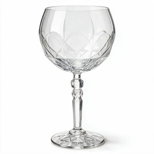 Lumina clear cocktail glass with a tall stem and geometric diamond cut bowl