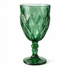 Sylvan green cocktail glass with diamond cut facets and a short stem