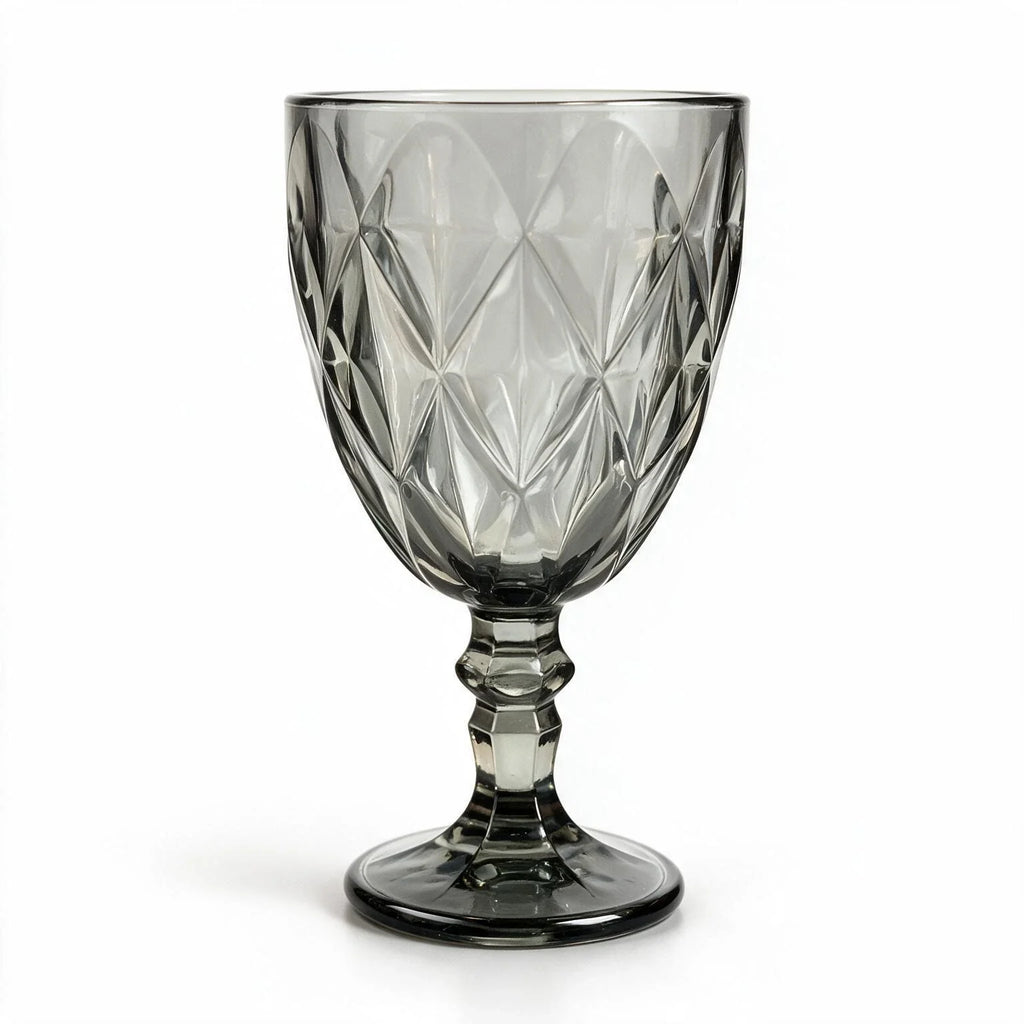 Nocturne black cocktail glass with diamond cut facets and a short stem