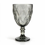 Nocturne black cocktail glass with diamond cut facets and a short stem