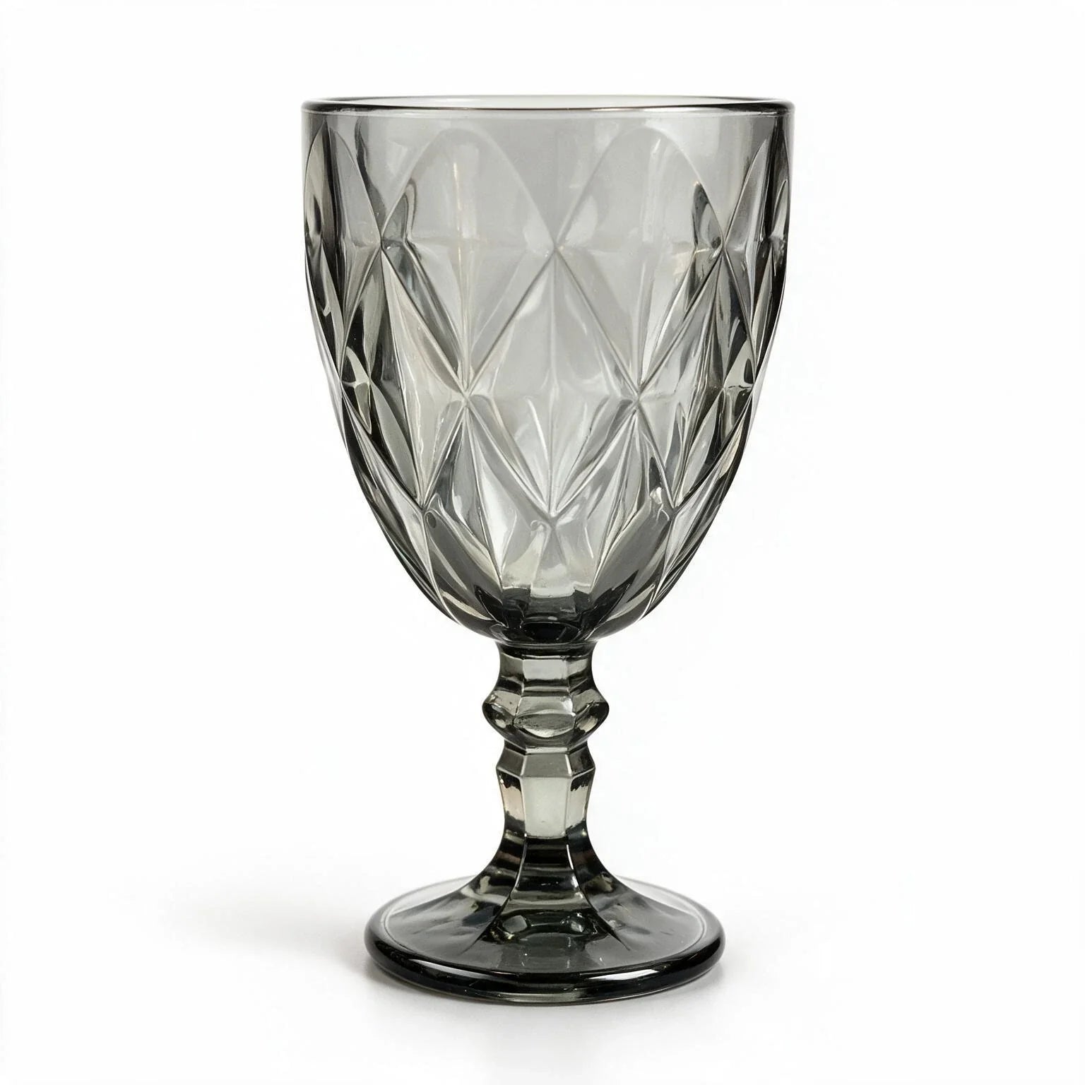 Nocturne black cocktail glass with diamond cut facets and a short stem
