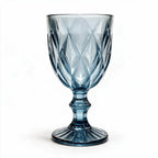 Marina blue cocktail glass with diamond cut facets and a short stem