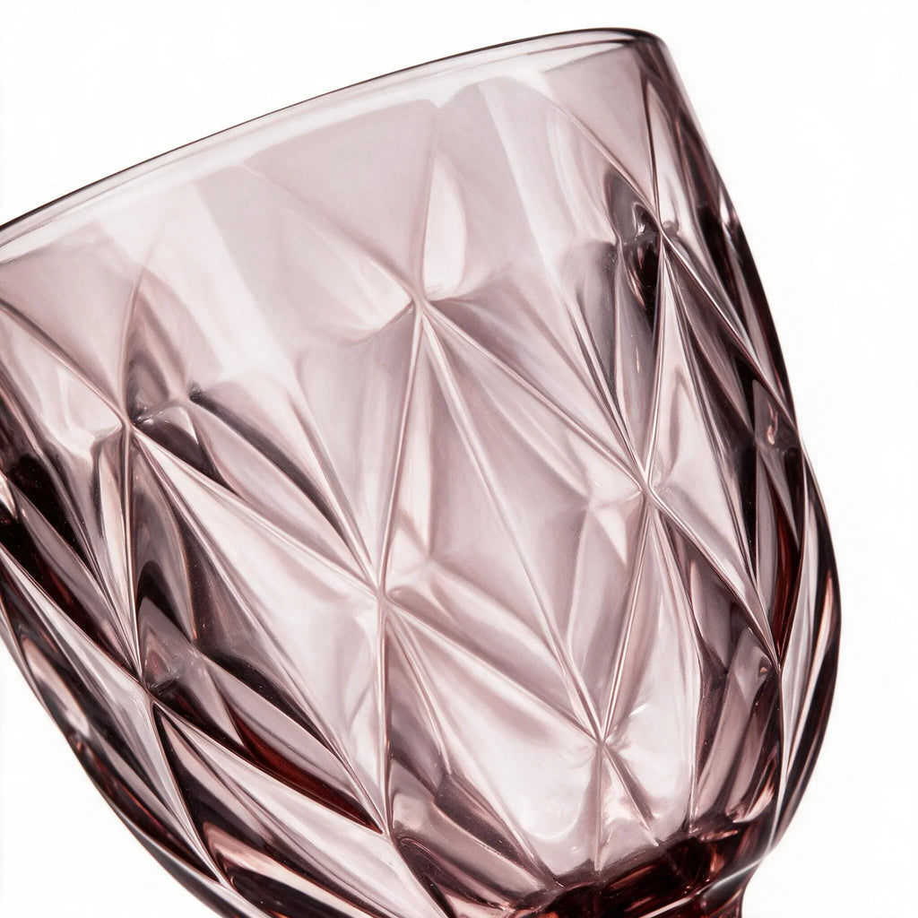 Amara dusky rose cocktail glass with diamond cut facets and a short stem
