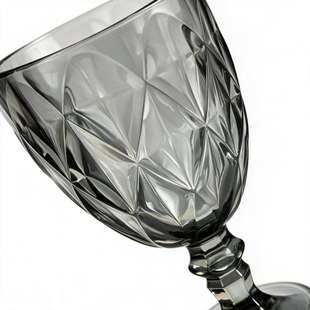 Nocturne black cocktail glass with diamond cut facets and a short stem