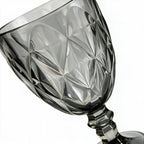 Nocturne black cocktail glass with diamond cut facets and a short stem