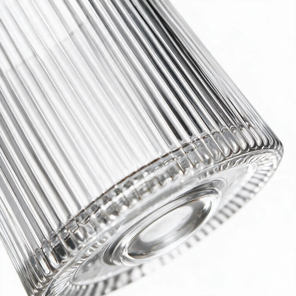 Coda clear whisky glass with a rotating base and ribbed texture