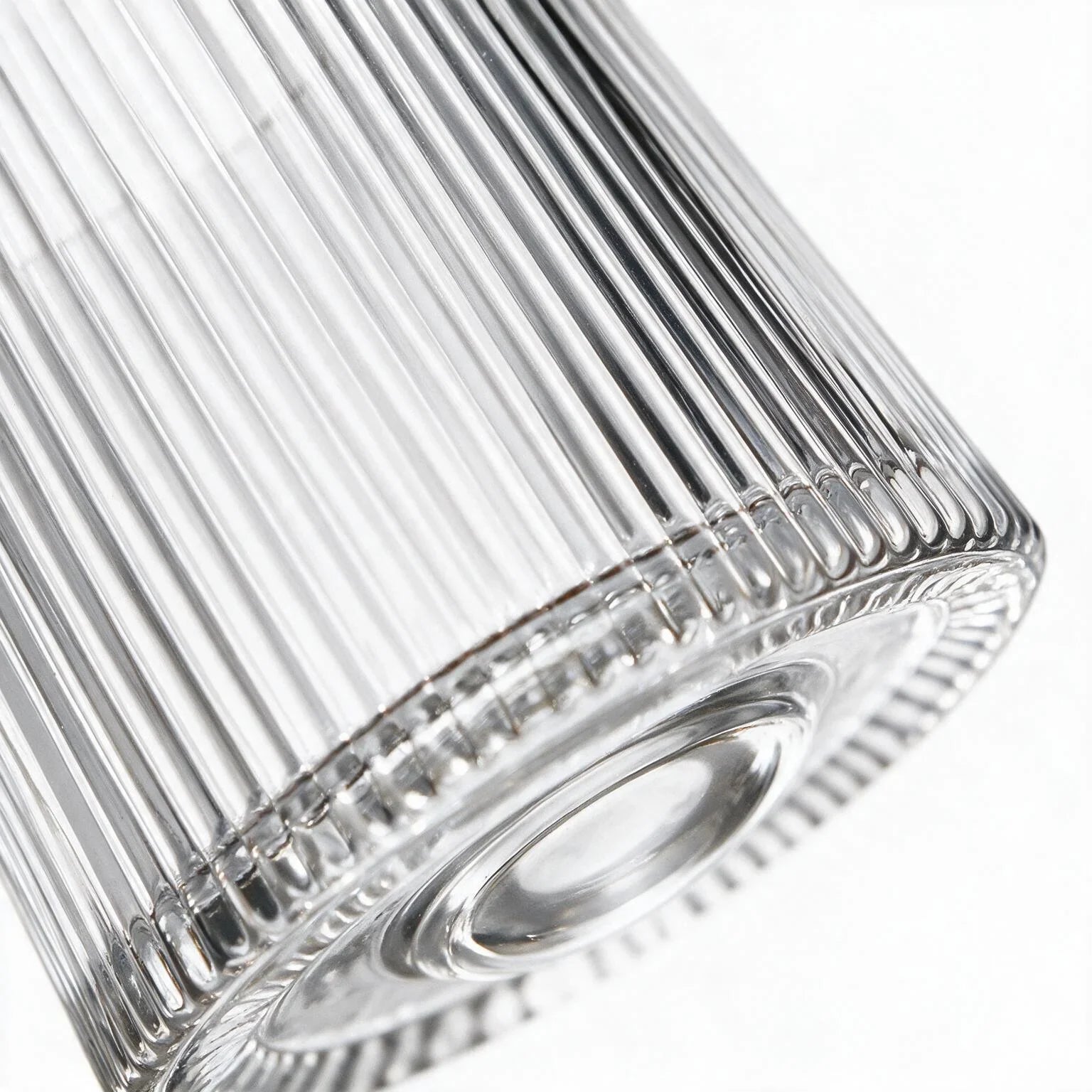 Coda clear whisky glass with a rotating base and ribbed texture