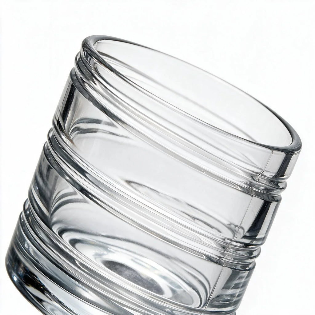 Helix clear whisky glass with a slanted rim and sweeping textured design