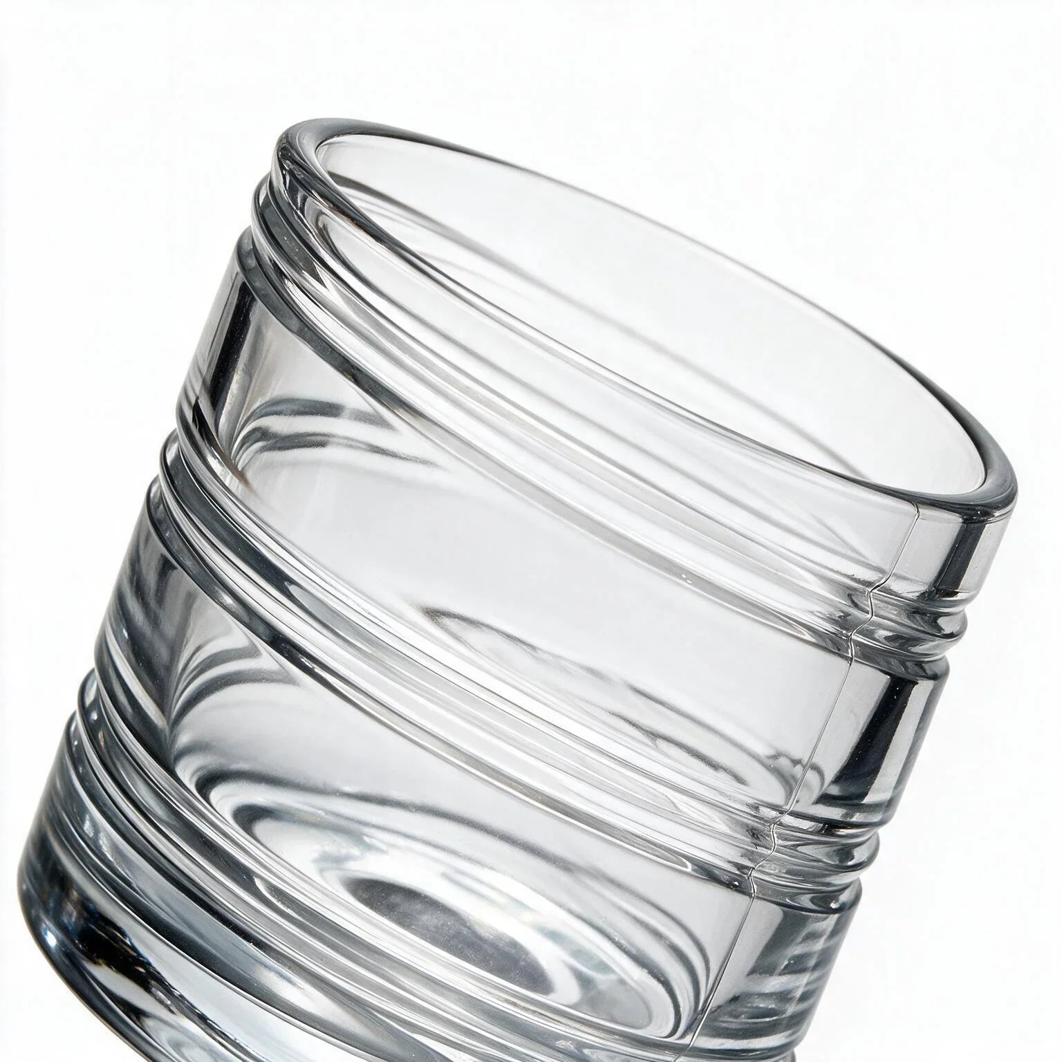 Helix clear whisky glass with a slanted rim and sweeping textured design