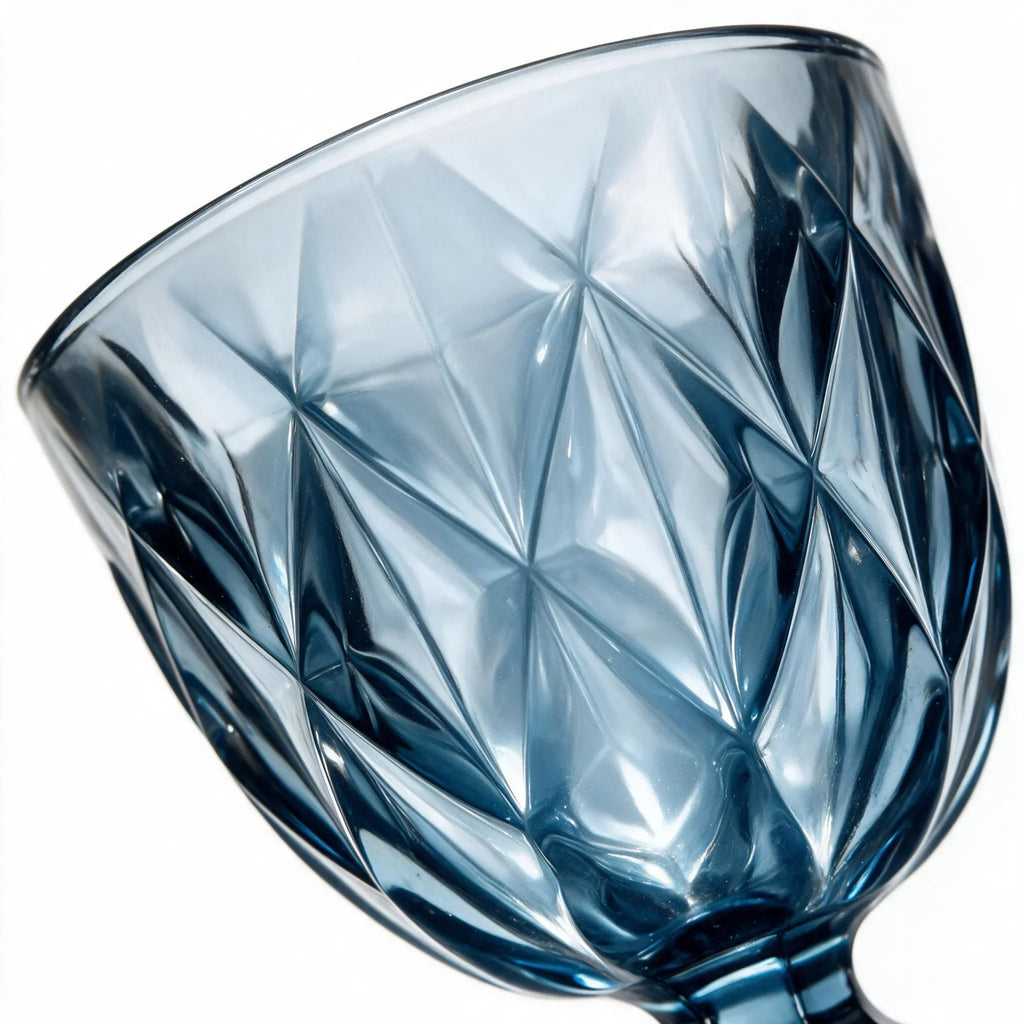 Marina blue cocktail glass with diamond cut facets and a short stem