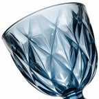 Marina blue cocktail glass with diamond cut facets and a short stem