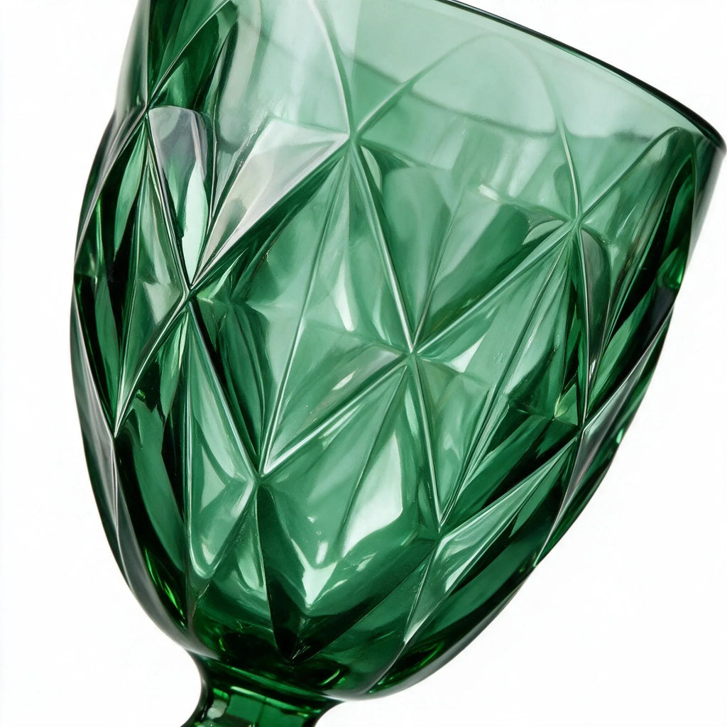 Sylvan green cocktail glass with diamond cut facets and a short stem