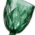 Sylvan green cocktail glass with diamond cut facets and a short stem